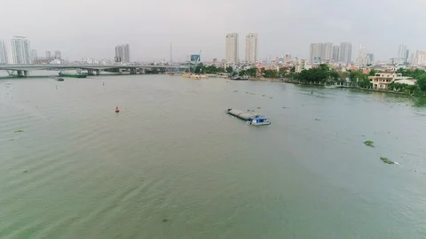 Aerial view fly over a ferry on a river in city Stock Footage 101953733