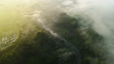 Aerial view. fly over the mist and the river in the morning. Dramatic and bea Stock Footage 187602210