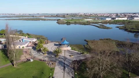 Aerial view of fly by over park entrance near riverside Stock Footage 160424931