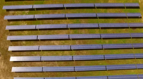 Aerial view Fly Over Solar Power Panels Field Green Energy Clean Energy Stock Footage 62932914