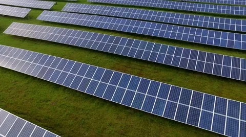 Aerial view fly over Solar Power Panels Field Green Energy Clean Energy Stock Footage 63526647