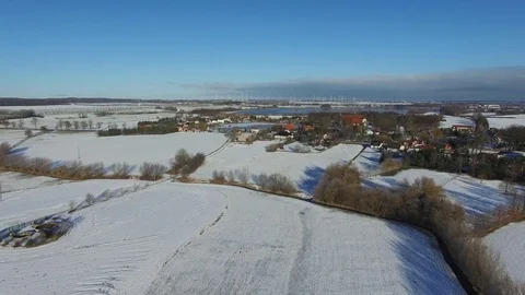 Aerial view fly over winter forrest landscape with  village and lakes in germany Stock Footage 71484365