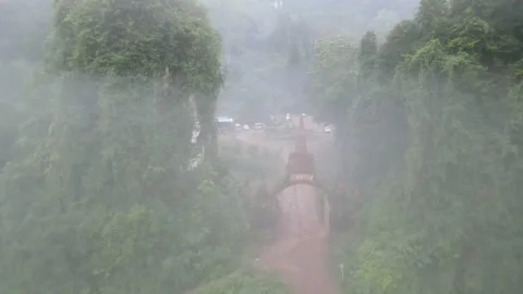 Aerial view of fly through and over gate with pagoda on top and stay over Stock-Footage 142086484