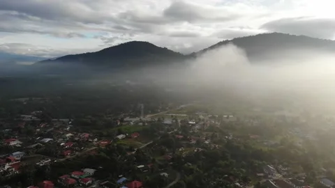 Aerial view fly towards low clouds over Kamunting, Taiping, Perak Stock Footage 227857565