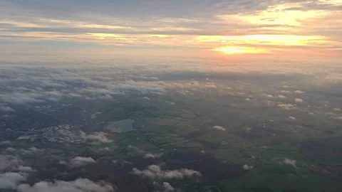 Aerial view flying above clouds at sunrise. Gold colored sunrise cloudiness 4K. Video stock 262974801