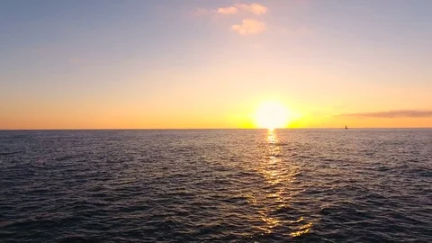 Aerial View. Flying above the sandy beach stone sea at sunset. Stock-Footage 71348201
