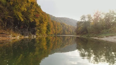 Aerial view: Flying along the river. Incredible colorful autumn view Vídeo Stock 97277626
