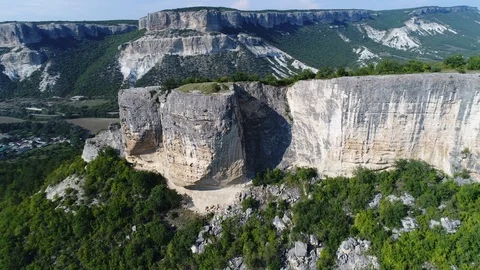 Aerial view. Flying around a large white limestone rock in the Crimea.  Stock Footage 94470780
