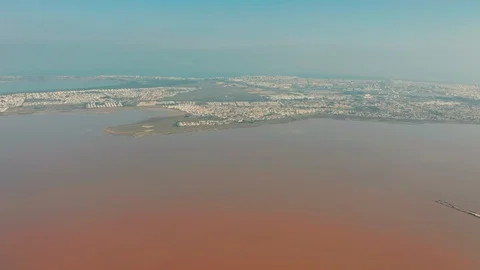 Aerial view. Flying around the Salinas of Torrevieja - salted lake where is a Stockbeeldmateriaal 128037306