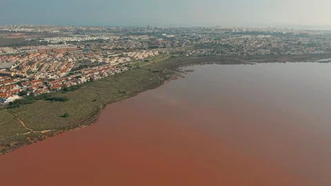 Aerial view. Flying around the Salinas of Torrevieja - salted lake where is a Vidéo 128037617
