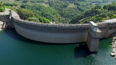 Aerial view flying away from Belesar hydroelectric dam reservoir Stock Footage 345139239