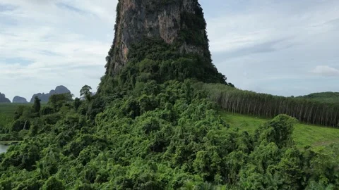 Aerial View Flying Away from Limestone Karst Mountain in Phang Nga, Thailand Video stock 334623099