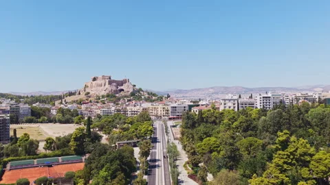 Aerial view flying backward revealing Athens and the Acropolis Stock Footage 345408518