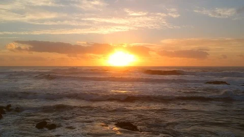 Aerial view flying backwards at sunset over ocean in summer 스톡 동영상 95127067