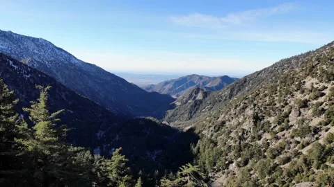 Aerial View of Flying Backwards Through Trees on Mountains Stock Footage 142304178