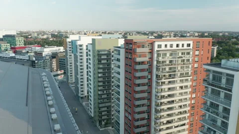 Aerial view flying between buildings and over Friends Arena in Stockholm Stock Footage 138900842