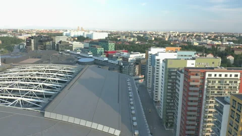 Aerial view flying between buildings and over Friends Arena in Solna, Sweden Stock Footage 138900968