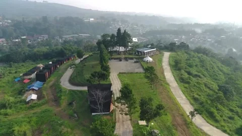 Aerial view, flying between the palms, trees in a tropical forest, Sunrise in Video stock 202292134