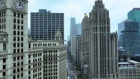 Aerial view flying in Chicago loop over Magnificent Mile on cold snowy day Stock Footage 231168505
