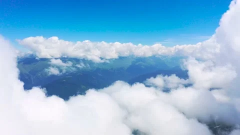 Aerial view flying in the clouds over the mountain range Stock Footage 139649037