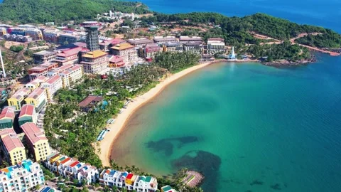 Aerial view flying into a crystal clear turquoise bay in Phu Quoc 4K Stock Footage 334986465