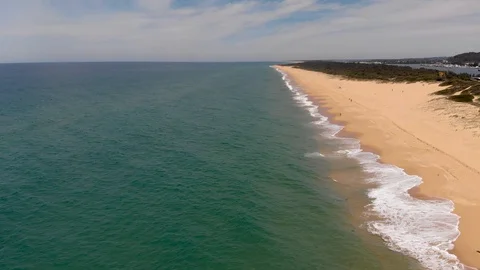 Aerial View Flying Down Beach with Waves Breaking Beach On Right Side Stock Footage 99020079