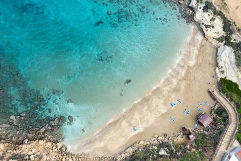 Aerial view from flying drone of empty sandy beach golden sand in winter. Stockfoto's
