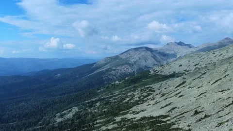 Aerial view from flying drone on mountain forest background. Stock Footage 138804148