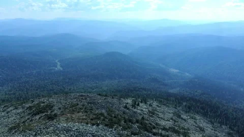 Aerial view from flying drone on mountain forest background. Stock Footage 138804150