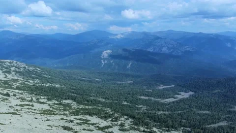 Aerial view from flying drone on mountain forest background. Stock Footage 138804182