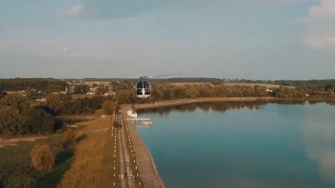 Aerial view of flying helicopter Stock Footage 130486416