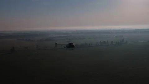 Aerial view of flying helicopter Stock Footage 130486442