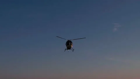 Aerial view of flying helicopter Stock Footage 130486478