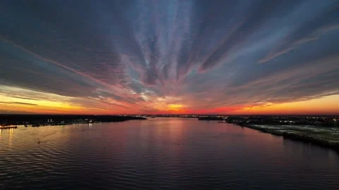 Aerial View Flying into Intense Sunset Delaware River Philadelphia Stock Footage 166877816