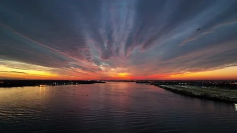 Aerial View Flying into Intense Sunset Delaware River Philadelphia Stock Footage 166877817