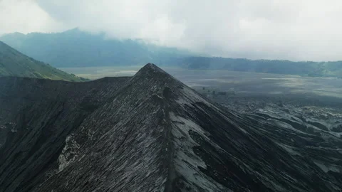 Aerial view flying to mount active volcano cloudy Stock Footage 277184270