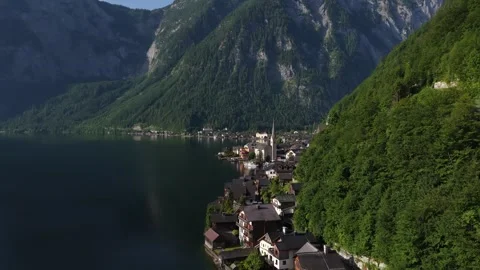 Aerial view flying over the alpine village of hallstatt, austria Stock Footage 318833796