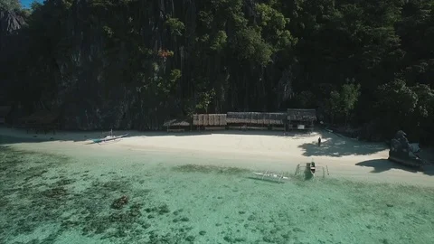 Aerial view flying over amazing white sand beach and tropical coral reef lagoon 스톡 동영상 84043902