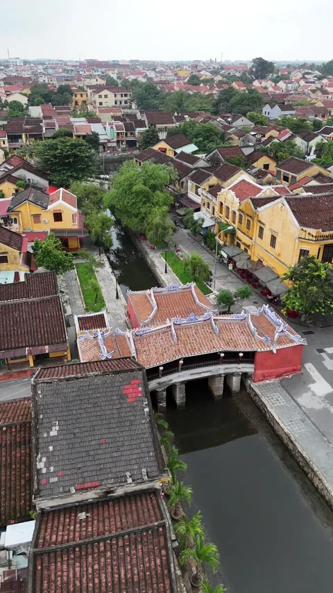 Aerial View Flying Over the Ancient Japanese Covered Bridge in Hoi An, Vietnam Stock Footage 335832389