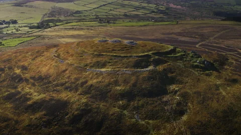 Aerial view flying over ancient irish hillfort ruins Stock Footage 336755722