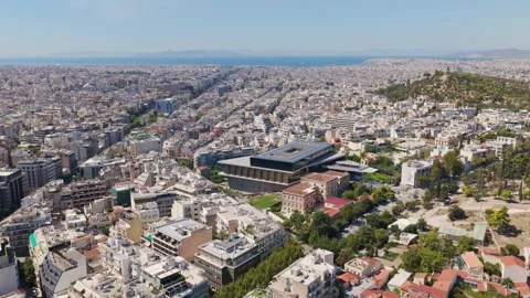 Aerial view flying over Athens Greece towards the Acropolis Museum Stock Footage 345408290