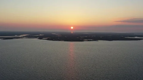 Aerial View Flying Over Bay Into Sunrise Stock Footage 101450271
