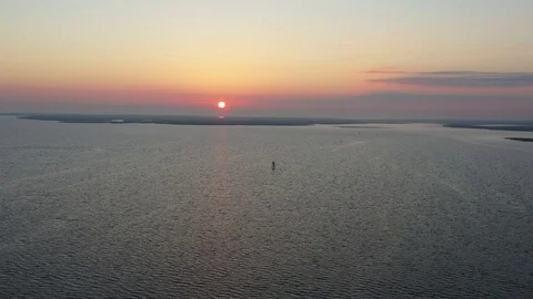 Aerial View Flying Over Bay Into Sunrise Stock Footage 101450310