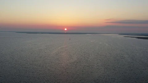 Aerial View Flying Over Bay Into Sunrise Stock Footage 101450324