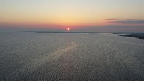 Aerial View Flying Over Bay Into Sunrise Stock Footage 101450330