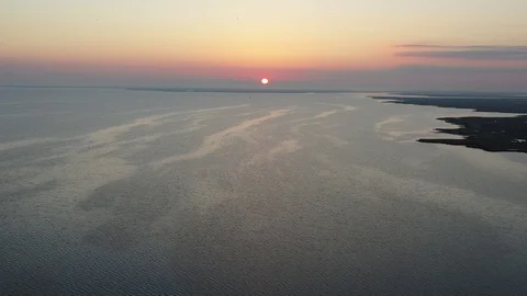 Aerial View Flying Over Bay Into Sunrise Stock Footage 101450339