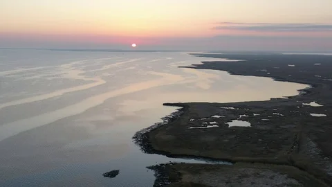 Aerial View Flying Over Bay Into Sunrise Stock Footage 101450340