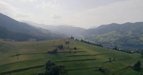 Aerial view: Flying over a beautiful field in the Carpathian Mountains near the 스톡 동영상 95877257