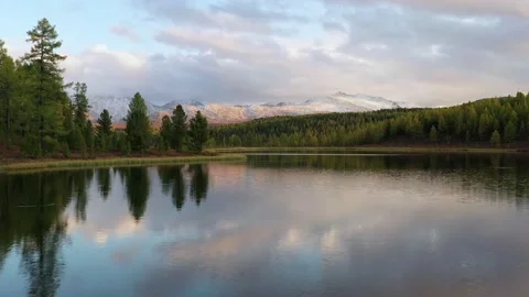 Aerial View. Flying over the beautiful lake near mountains. Aerial camera shot.  Stock Footage 166830614