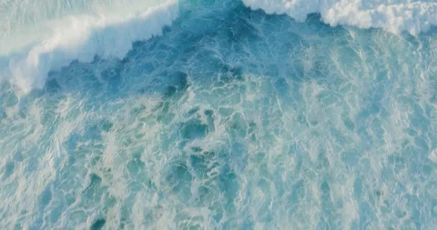 Aerial view flying over a breaking ocean wave Stock Footage 119752214